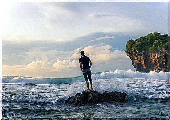 Boy before the sea thinking about psychological strengths