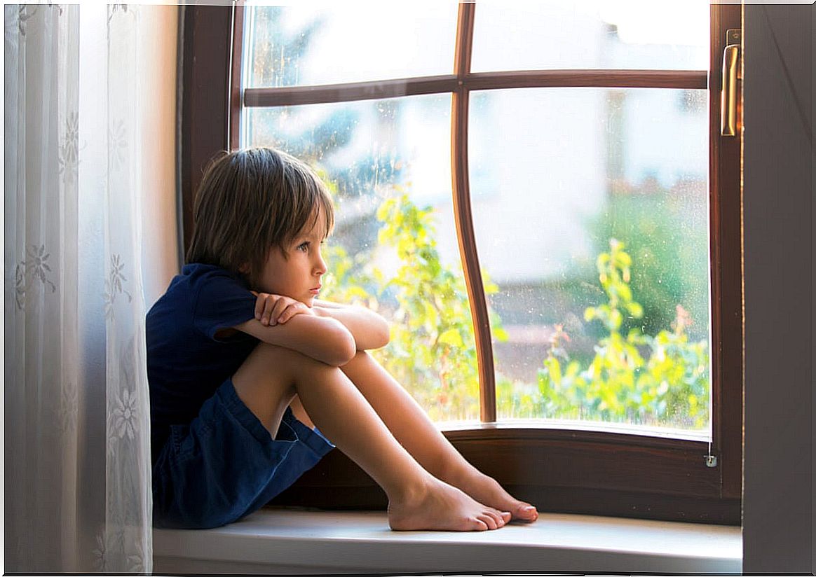 Child looking out the window representing the ways in which your emotions are invalidated