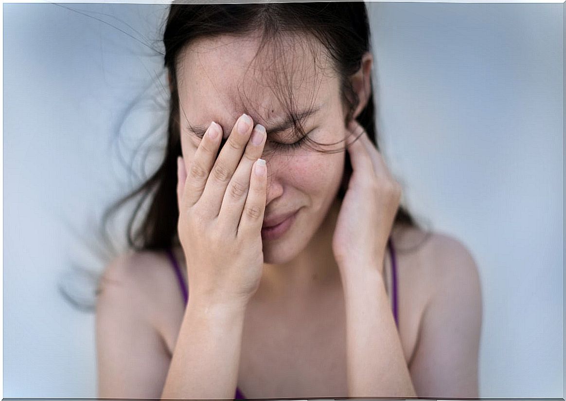 Woman with anxiety and headache