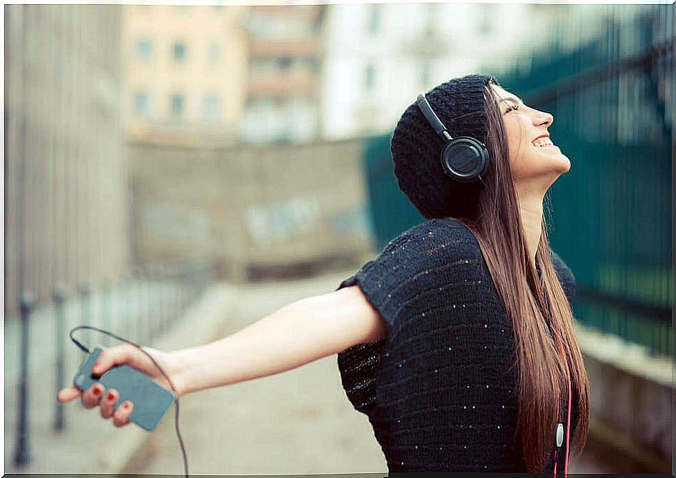 Happy young man listening to music