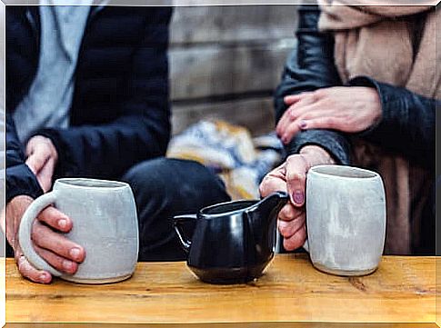 Couple talking while having coffee