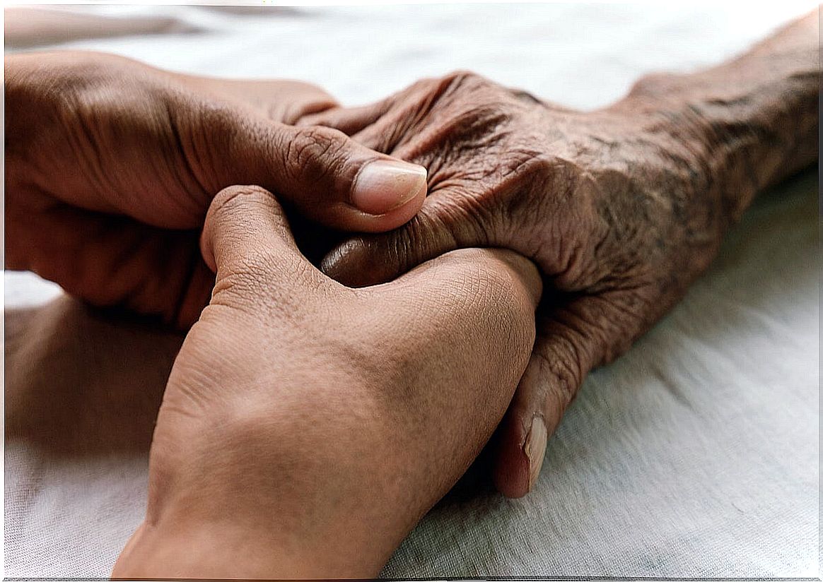 Person holding the hand of his relative