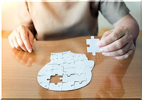 Woman doing a puzzle of a face