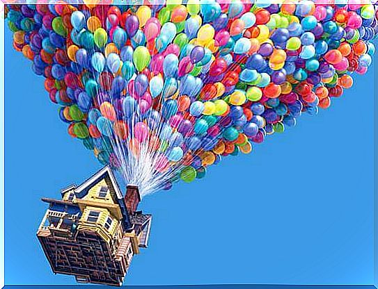 House flying with balloons