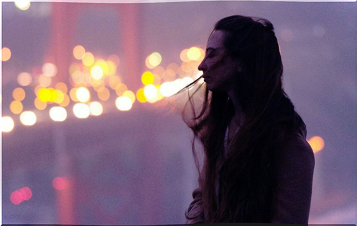 Girl alone on a bridge thinking about how to be a better person