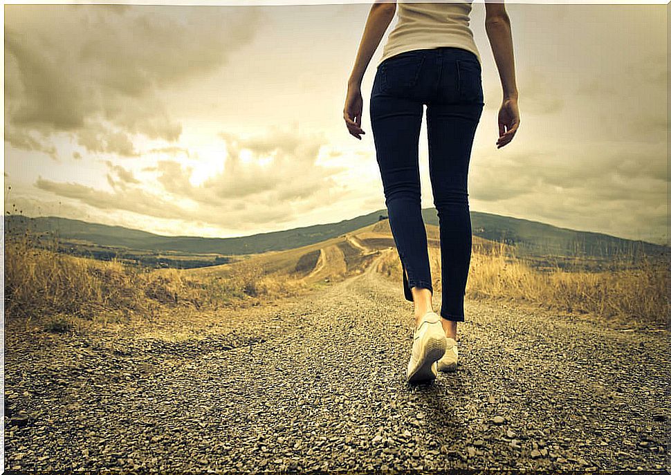 Woman walking on dirt road seeking to increase intelligence