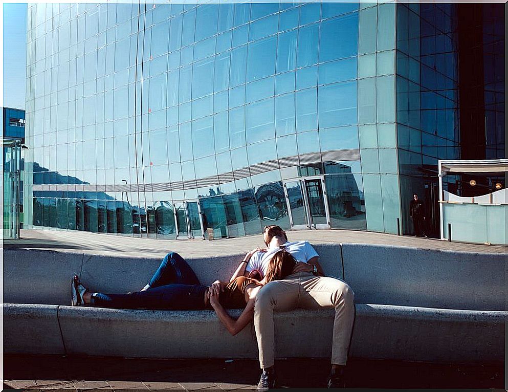 Couple sitting on stairs as an example of balanced relationships