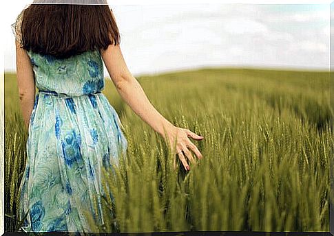 Woman walking through a field