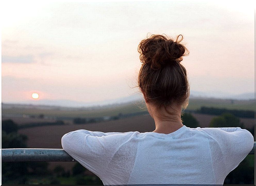 Woman looking at sunrise