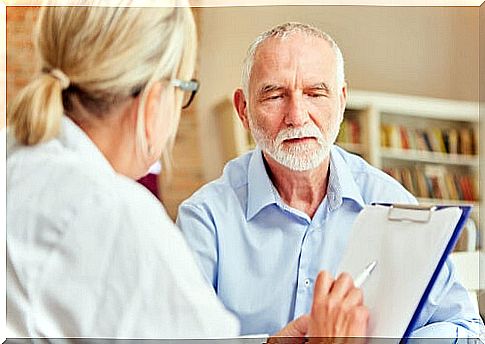 Doctor with man who has Alzheimer's 