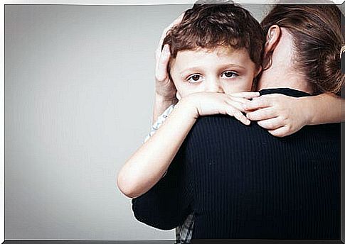 Boy hugging his mother