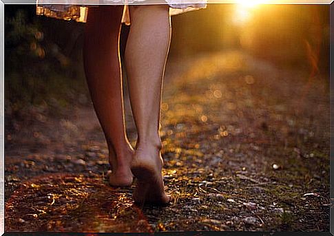 Woman walking barefoot