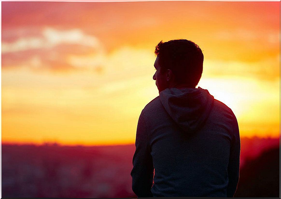 Man looks to the horizon distracted