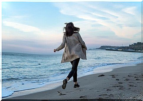 Woman strolling on the beach