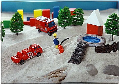 Sand with toys to represent the sandbox technique