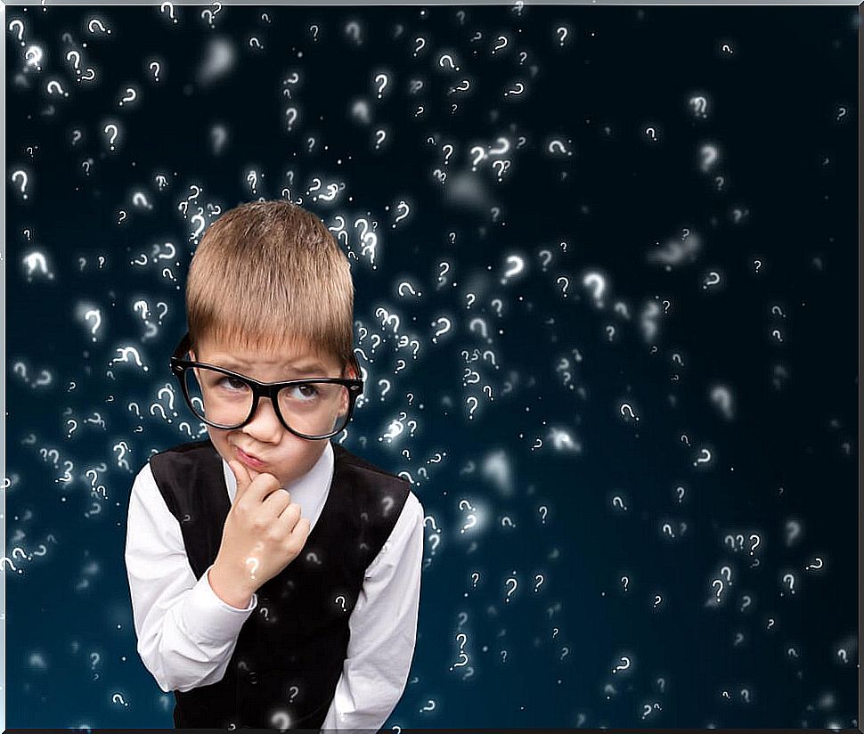 Boy with glasses thinking