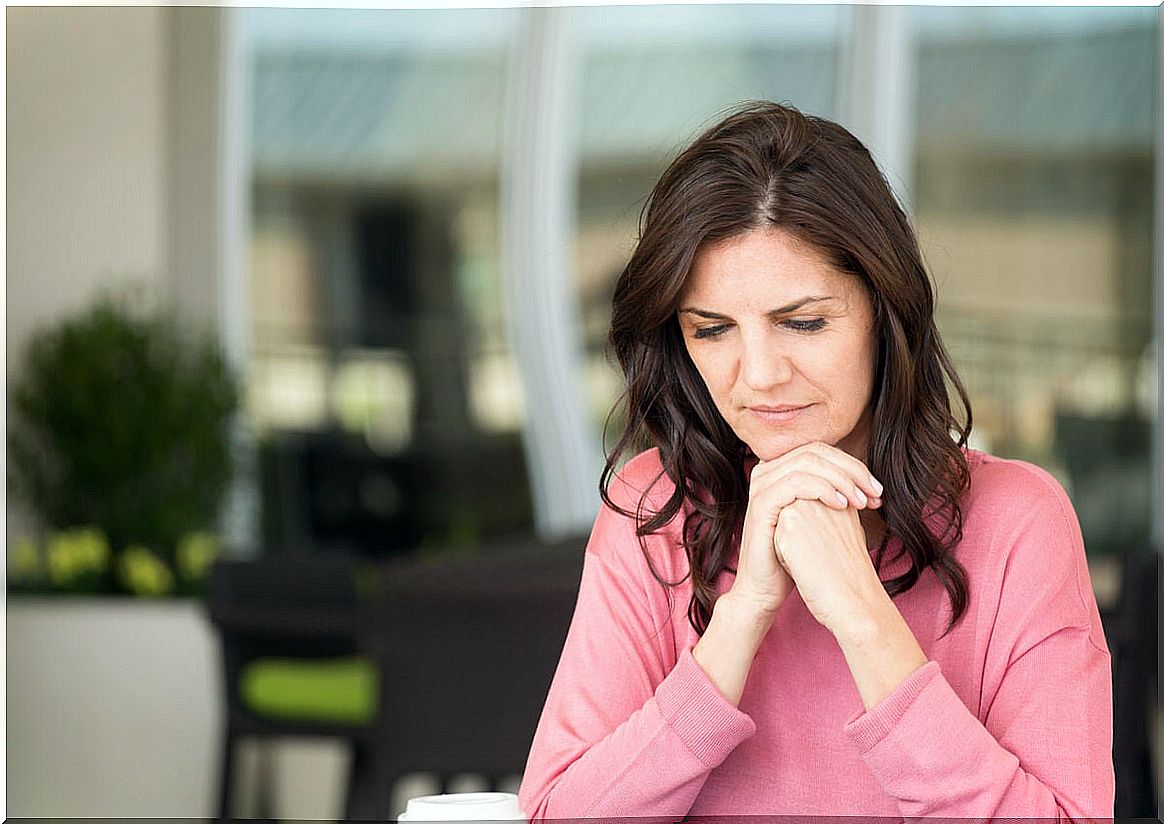 Woman thinking about how menopause affects mood