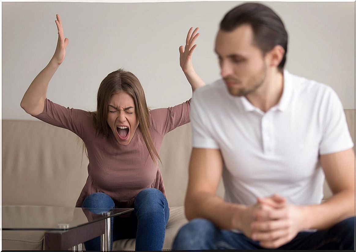 Woman screaming very angry to symbolize that the brain is looking for someone to blame for what happens to us.