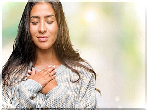 Woman with hands on chest symbolizing learn to trust you