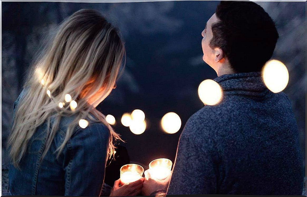 Couple surrounded by lights representing that loving is giving what you don't have